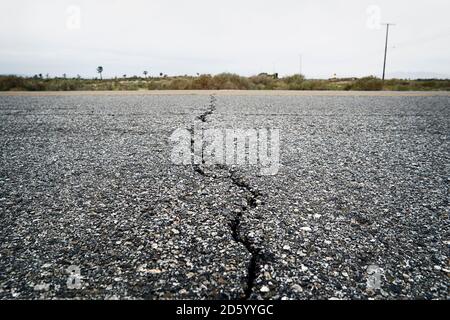 USA, California, Crack in tarmac of road Stock Photo