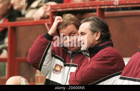 West Ham United manager Harry Redknapp (l) cannot watch as Manchester United score seven goals   Stock Photo