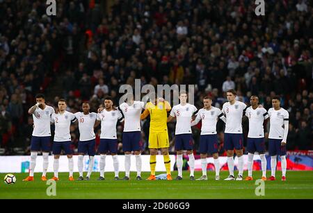 (left to right) England's Kyle Walker, Kieran Trippier, Raheem Sterling, Alex Oxlade-Chamberlain, Jordan Henderson, England goalkeeper Jordan Pickford, John Stones, Jamie Vardy, James Tarkowski, Ashley Young and Jesse Lingard observe a minutes applause ahead of the match Stock Photo