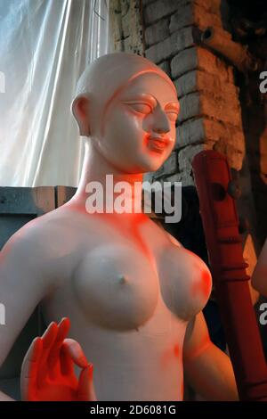 Portrait of Maa Saraswati. Clay idol of Hindu Goddess Saraswati under preparations for Bengal's Durga Puja festival in Kolkata. Stock Photo