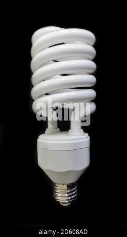 Lamp. Powersave lamp. White light bulb on black background Stock Photo