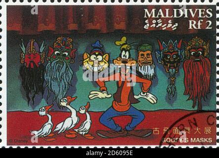 MALDIVE ISLANDS - CIRCA 1996: stamp printed by Maldive Islands, shows Goofy’s masks, circa 1996 Stock Photo