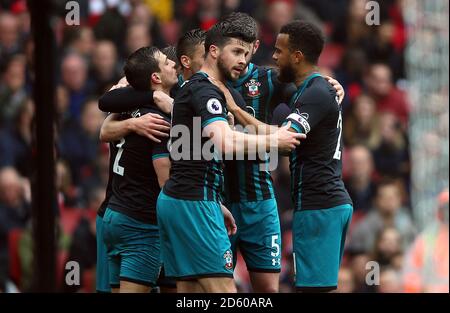 Southampton's Shane Long (centre) celebrates scoring his team's first goal of the game with team-mates Stock Photo