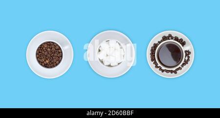 Three cups on saucers with sugar cubes, coffee and coffee beans on a blue background. The view from the top. Stock Photo