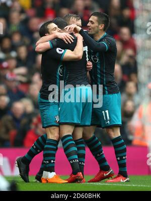 Southampton's Shane Long (centre) celebrates scoring his team's first goal of the game with team-mates Stock Photo