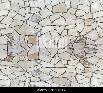 Closeup of dry stone wall as seamless background Stock Photo