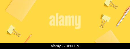 Creative banner with school equipment on a yellow background. Monochrome composition with copy space. Stock Photo