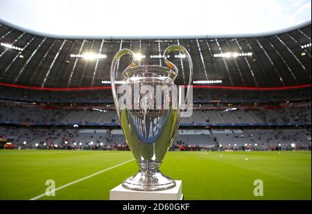 The Champions League trophy on display on the pitch ahead of the match  Stock Photo