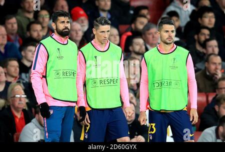 Atletico Madrid's Diego Costa (left), Fernando Torres (centre) and Machin Vitolo (right) on the touchline Stock Photo