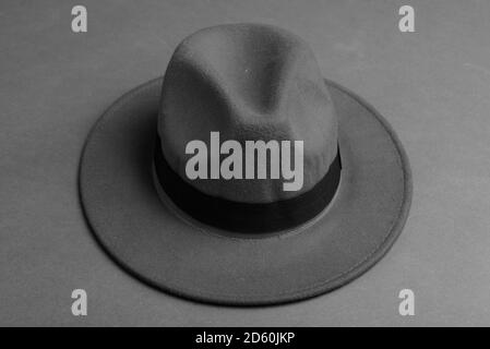 Fedora Hat Against Gray Background In Black And White Stock Photo - Alamy
