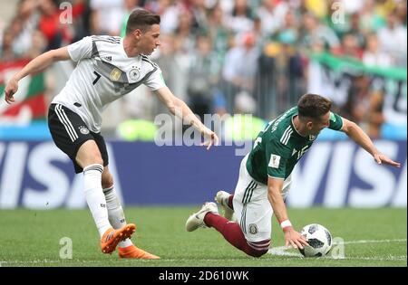 Germany's Julian Draxler (left) and Mexico's Hector Herrera in action during the game Stock Photo