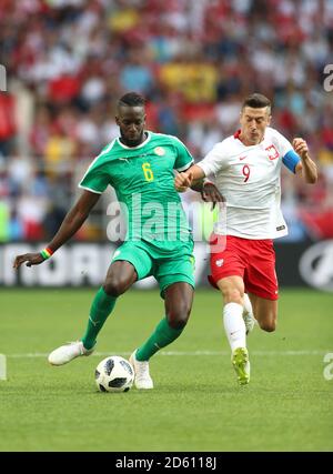 Senegal's Salif Sane (left) and Poland's Robert Lewandowski battle for the ball Stock Photo