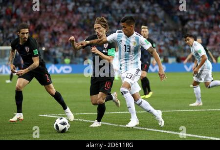 Argentina's Maximiliano Meza (right) and Croatia's Luka Modric battle for the ball Stock Photo