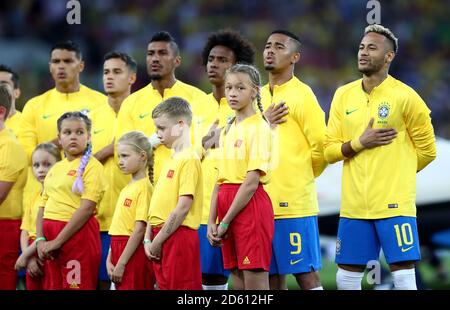 Brazil's Willian (centre), Gabriel Jesus and Neymar sing the national anthem prior to the match Stock Photo