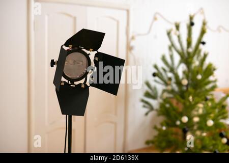Photography studio flash on a lighting stand on white background with lamp. Proffetional equipment like monobloc or monolight. Stock Photo