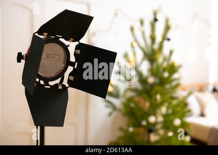 Photography studio flash on a lighting stand on white background with lamp. Proffetional equipment like monobloc or monolight. Stock Photo