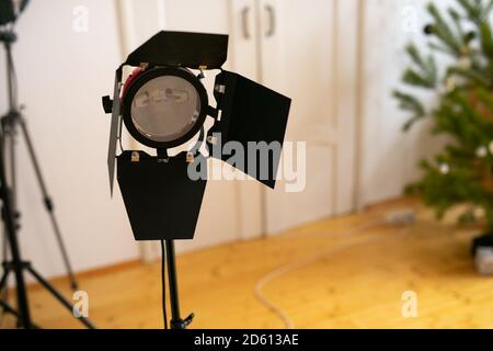 Photography studio flash on a lighting stand on white background with lamp. Proffetional equipment like monobloc or monolight. Stock Photo