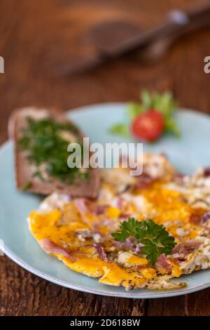 scrambled eggs on a blue plate Stock Photo