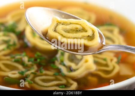 bavarian maultasche soup on wood Stock Photo