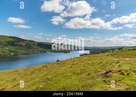 View over Coniston Water on a sunny day looking toward the south end of the lake towards Morecambe Bay from Torver Common Stock Photo