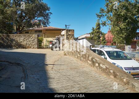 A typical driveway on sloping road between the streets and houses of Mount Abu, Rajasthan, India Stock Photo