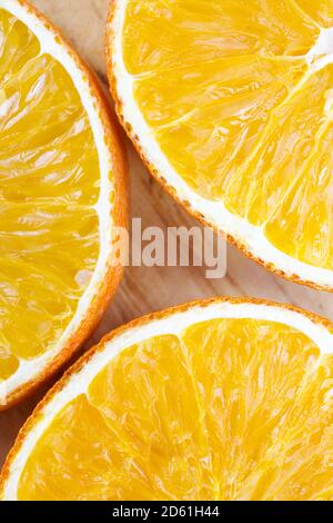 Food background flat lay. A few of citrus slices for background or cover.  Fruit background with a space for a text, suitable occasion card template. Stock Photo