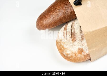 Freshly baked loaves of bread. Bakery products on white background with copy space Stock Photo