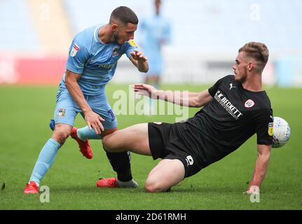 Coventry City's Conor Chaplin (left) and Barnsley's Liam Linsey during the Sky Bet League One match at the Ricoh Arena Coventry. Stock Photo