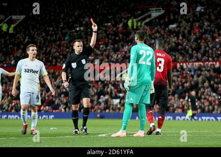 Referee Stuart Attwell shows Manchester United goalkeeper Sergio Romero a straight red card Stock Photo