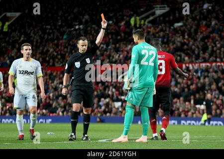 Referee Stuart Attwell shows Manchester United goalkeeper Sergio Romero a straight red card Stock Photo