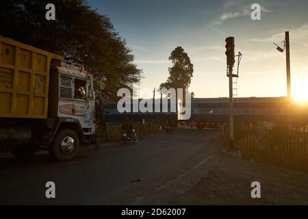 Early morning at a railway crossing somewhere in Ratlam, Madhya Pradesh, India. Stock Photo
