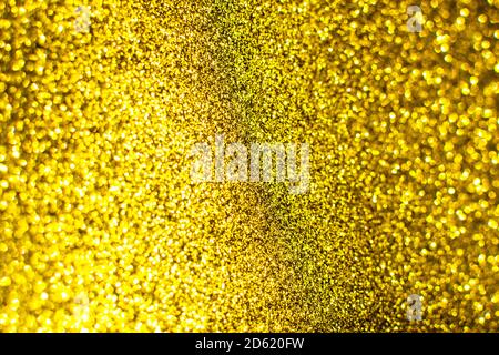 Flickering bright gold background. Bright gold or yellow texture. Stock Photo