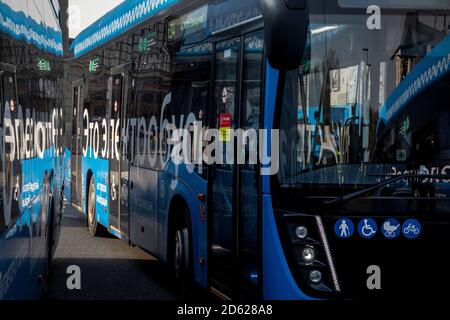 Electric buses stand in line to charge their batteries at the Kievsky railway station square in the center of Moscow, Russia Stock Photo