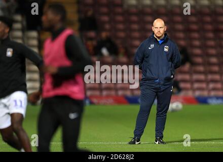 Coventry City physiotherapist Andrew Hemming looks on during the warm up Stock Photo