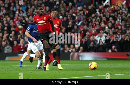 Manchester United's Paul Pogba (centre) has his penalty saved before scoring his side's first goal of the game Stock Photo