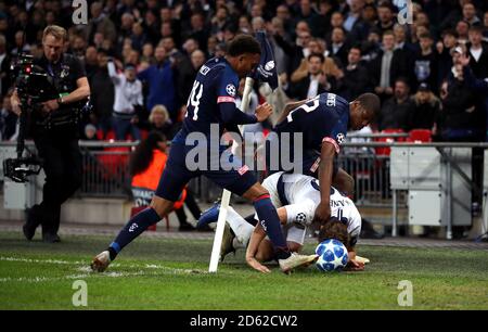 PSV Eindhoven's Donyell Malen (left) and Denzel Dumfries (centre) tackle Tottenham Hotspur's Harry Kane (right)  Stock Photo