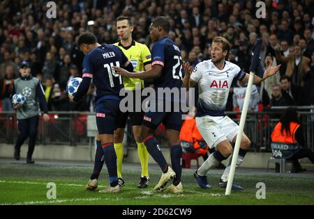 PSV Eindhoven's Donyell Malen (left) and Denzel Dumfries (centre) tackle Tottenham Hotspur's Harry Kane (right)  Stock Photo