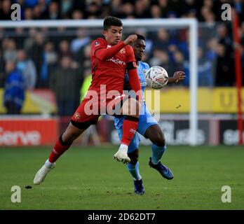 Walsall's Josh Gordon (left) and Coventry City's Brandon Mason battle for the ball Stock Photo