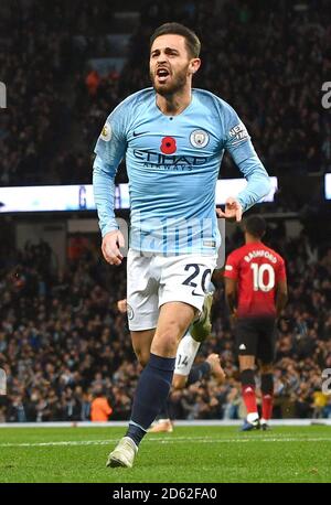 Manchester City's Bernardo Silva celebrates David Silva (not in image) scoring his side's first goal of the game Stock Photo