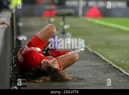 Wales' Ethan Ampadu appears injured after crashing in to the ad boards Stock Photo