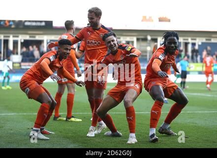 Luton Town's James Justin (left) celebrates scoring his side's third goal of the game with Harry Cornick (centre) and Pelly-Ruddock Mpanza (right)  Stock Photo