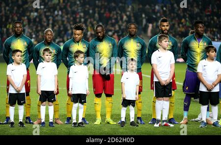 Cameroon's (left to right) Georges Mandjeck, Jeando Fuchs, Pierre Kunde, Stephane Bahoken, Arnaud Djum, Eric Maxim Choupo-Moting, Andre Onana line-up before kick-off Stock Photo