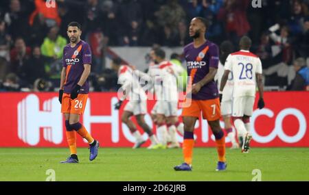 Manchester City's Riyad Mahrez (left) and Manchester City's Raheem Sterling show their dejection as their side concede  Stock Photo