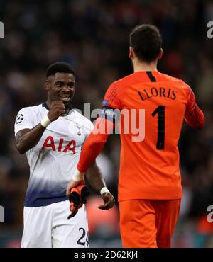 Tottenham Hotspur's Serge Aurier celebrates with team-mate Hugo Lloris Stock Photo