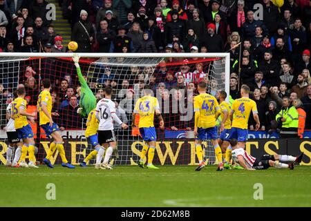 Leeds United goalkeeper Bailey Peacock-Farrell saves an overhead kick from Sheffield United's Conor Washington in the final minutes of the match Stock Photo