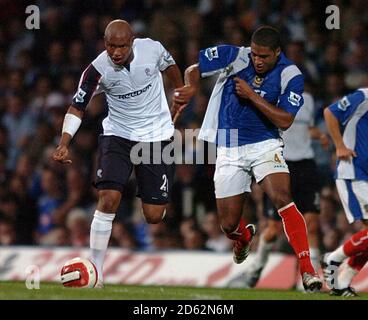 Bolton Wanderers' El-Hadji Diouf and Portsmouth's Glen Johnson Stock Photo