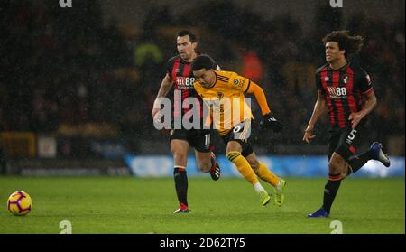 Wolverhampton Wanderers' Helder Costa (centre) and Bournemouth's Charlie Daniels (left) battle for the ball Stock Photo