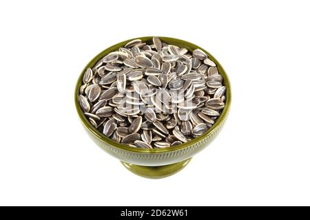 Sunflower seeds in a bowl on a white background Stock Photo