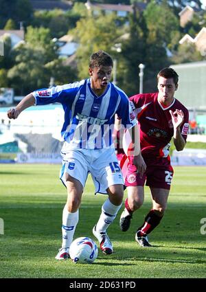 Blackpool s Shaun Barker battles for the ball against Brighton