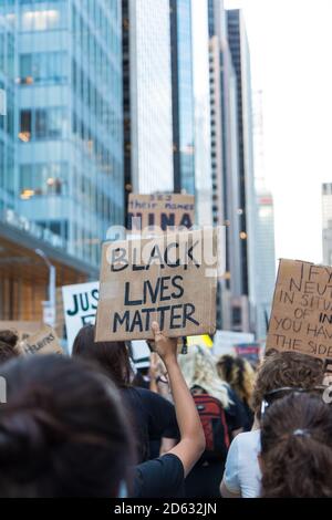 Protester holding up Black Lives Matter Sign during Juneteenth March, Midtown, New York City, New York, USA Stock Photo